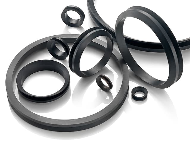 V-ring seals for protecting rotating shafts from dust, dirt, and contaminants in industrial applications.